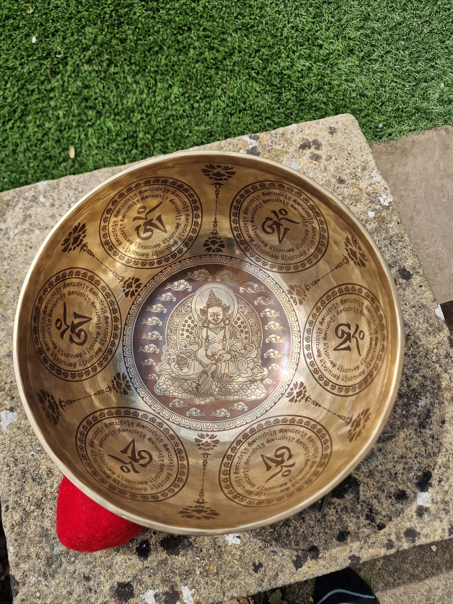 Close up of God of Wealth design inside Tibetan singing bowl 10 inch