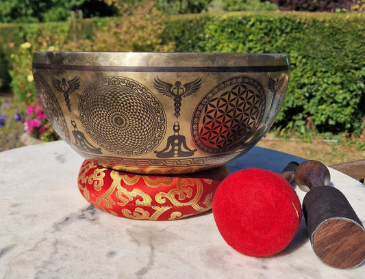 Side view of Footprints of Buddha singing bowl 12 inch with mallets and cushion