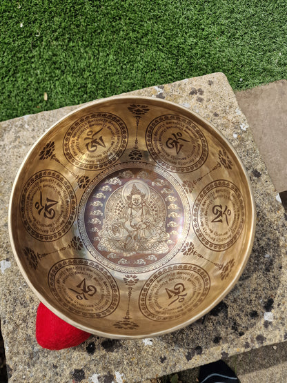 Close up of God of Wealth design inside Tibetan singing bowl 10 inch