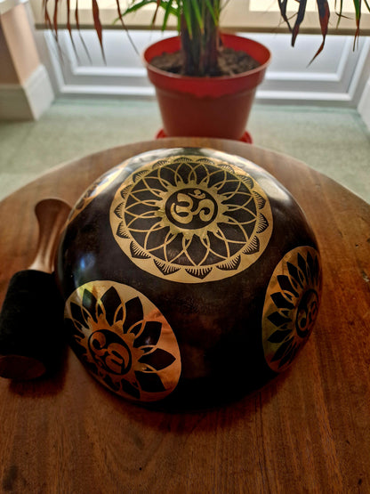 Bottom view of black OM lotus mandala singing bowl 9 inch