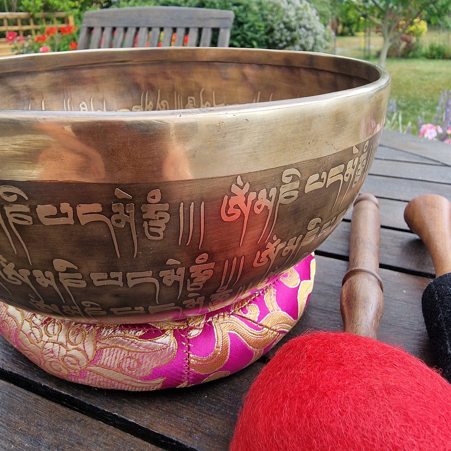 Mantra script engraving on side of Tibetan singing bowl 8 inch close up