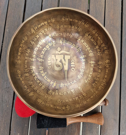 Close up of OM symbol and mantra engraving inside Tibetan singing bowl 8 inch