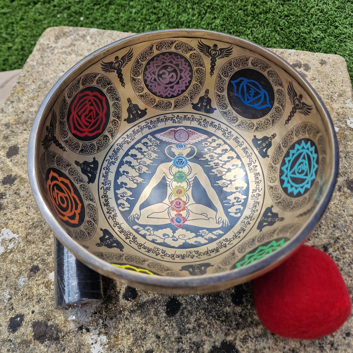 Angled view of Tibetan singing bowl with chakra design handmade in Nepal 7 metals