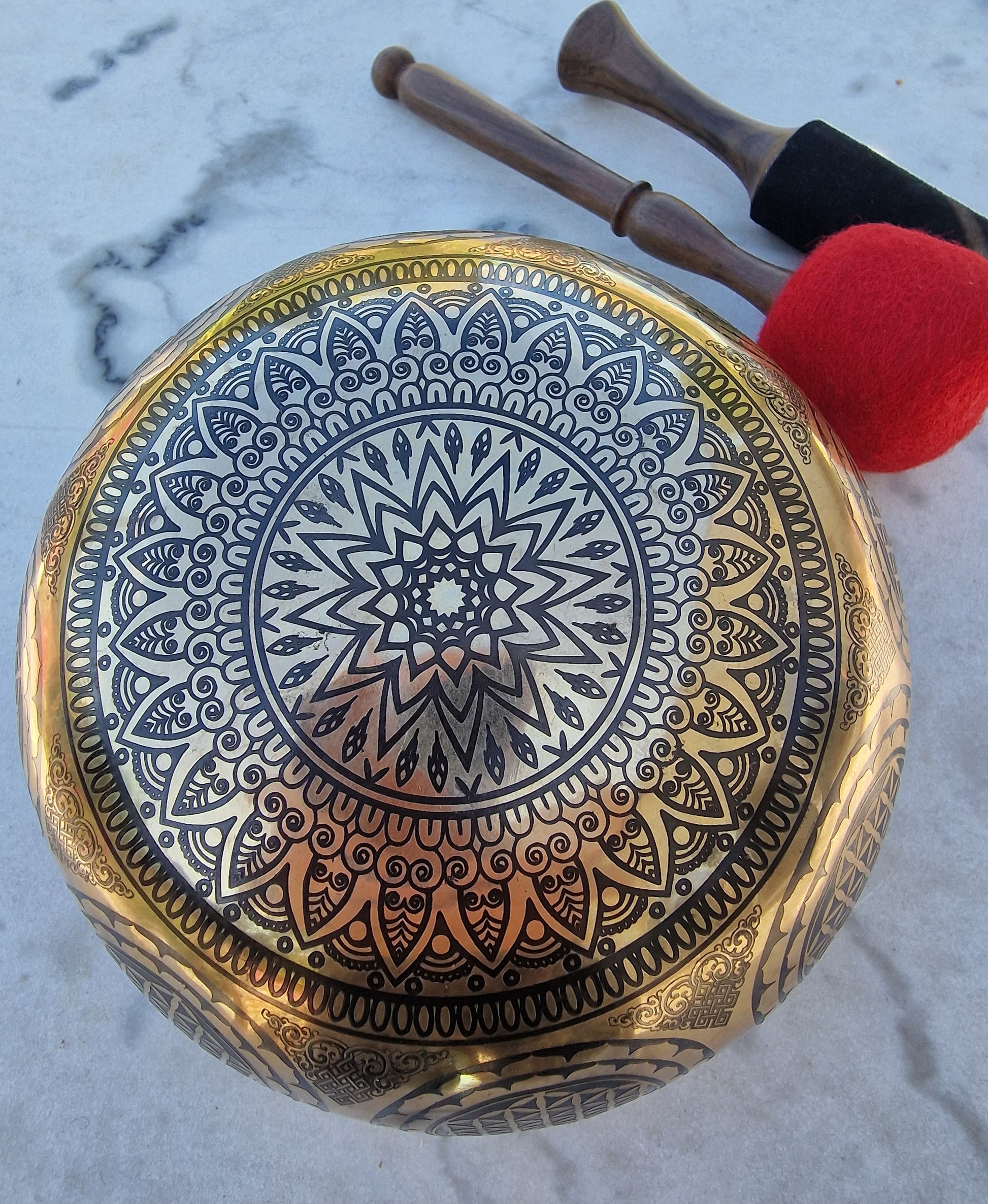 Close-up of sacred geometry mandala engraving inside Tibetan singing bowl