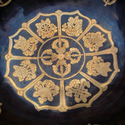 The Eight Auspicious Symbols surrounding the Double Dorje represent protection, wisdom, abundance and spiritual awakening